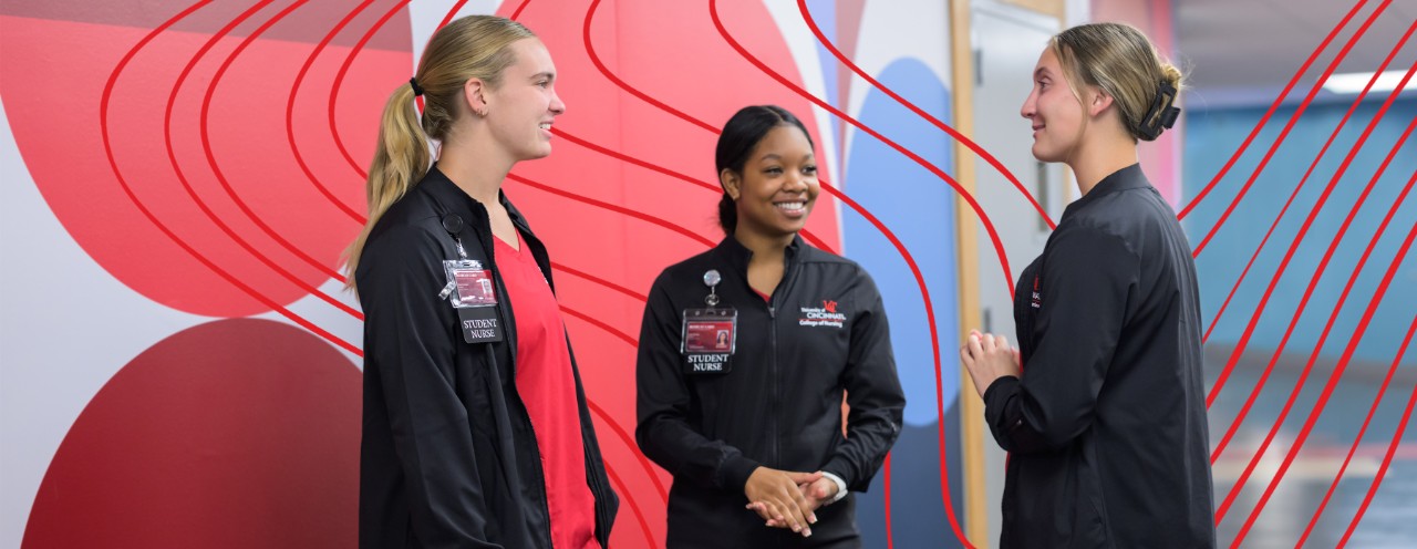 3 students standing at the hallway