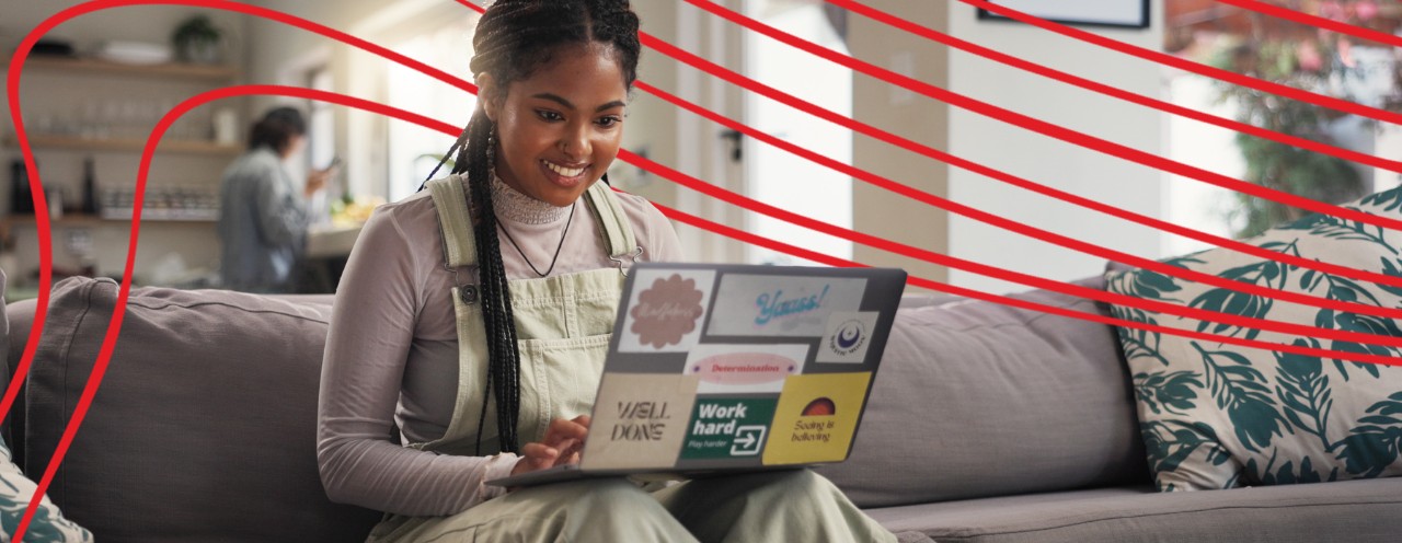 young woman on couch with laptop